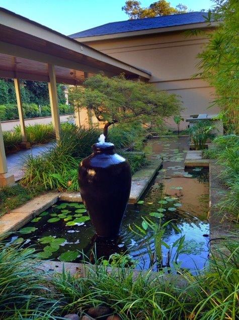 Water feature covered walkway