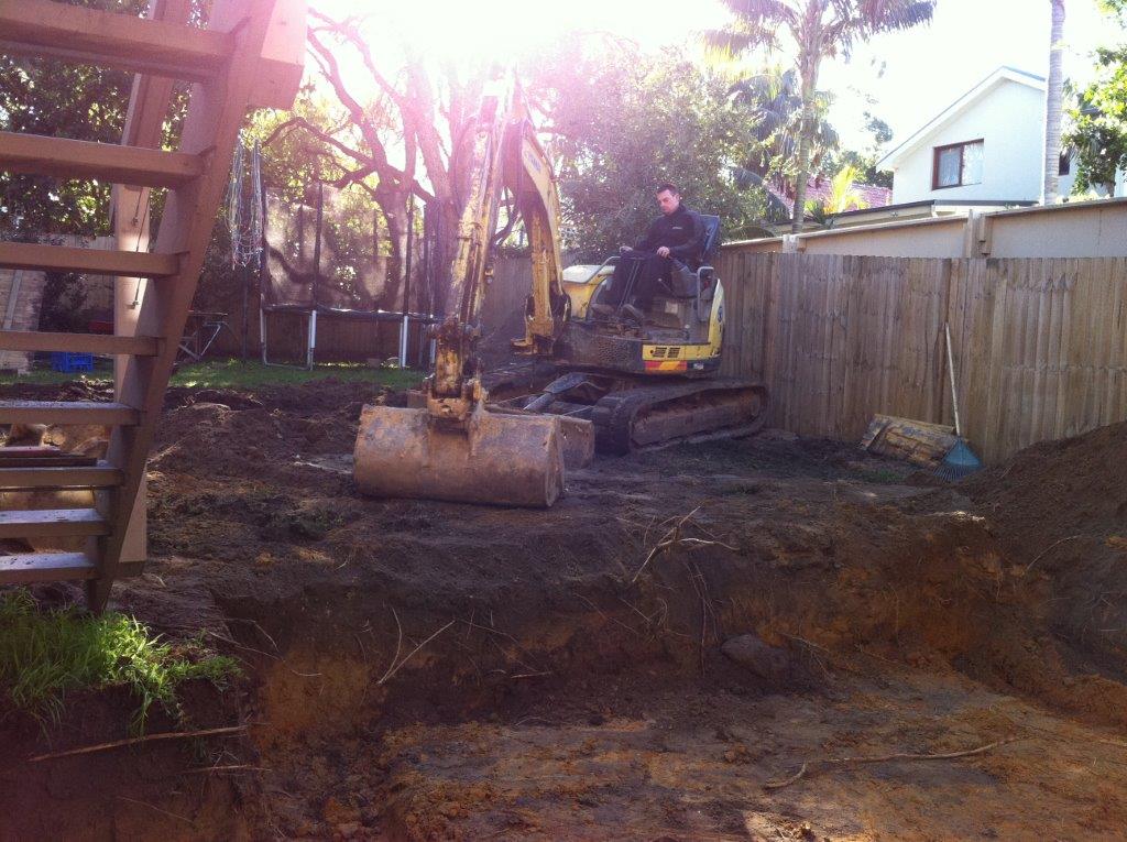 Levelling the lawn with a digger