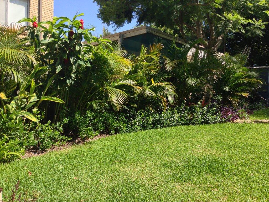 Stairs create a level lawn with trampoline